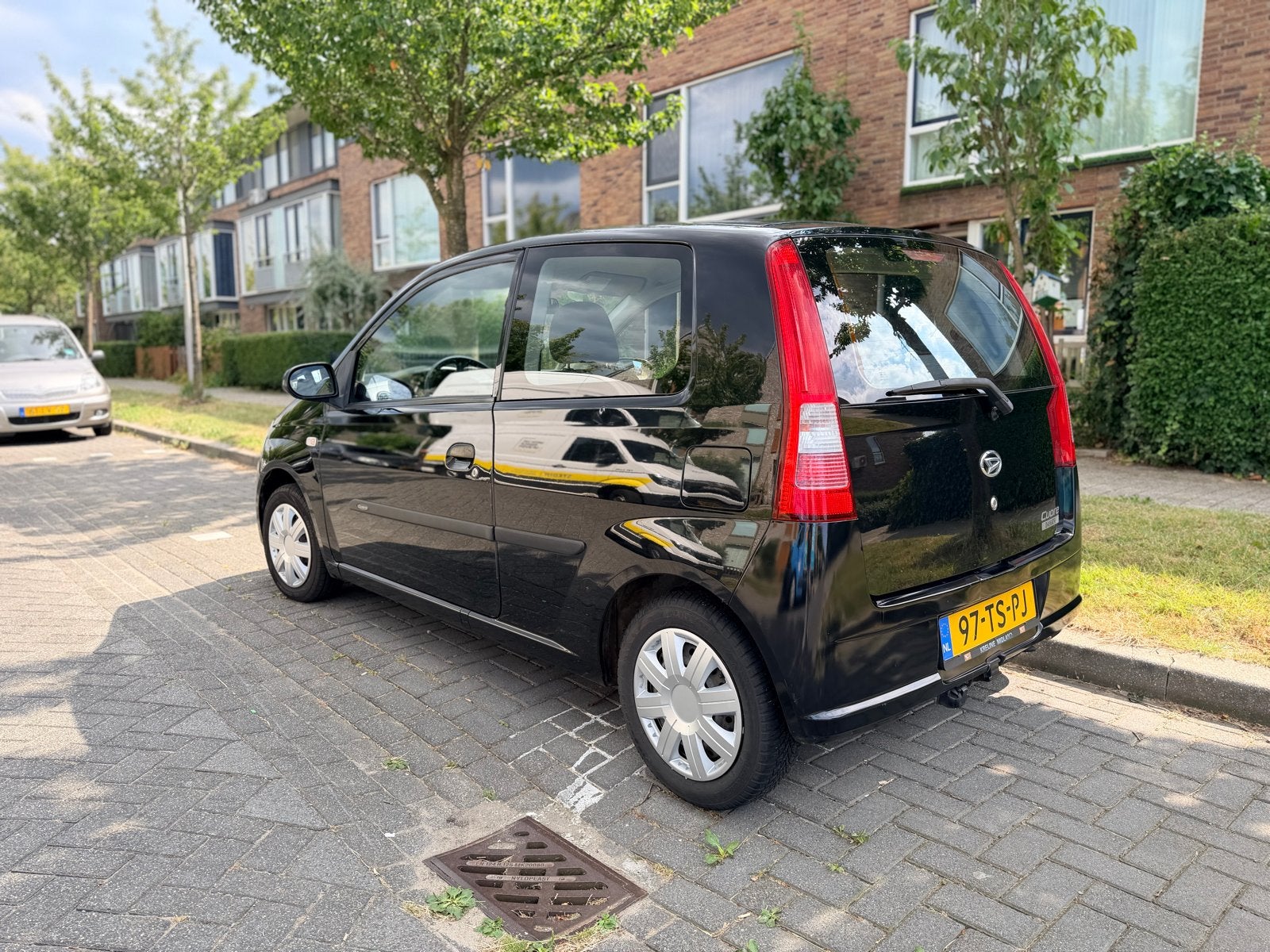 Daihatsu Cuore 1.0-12V Nagano Automaat Airco Trekhaak Dealer, Stof, 600 kg, Zwart, 18 €/maand