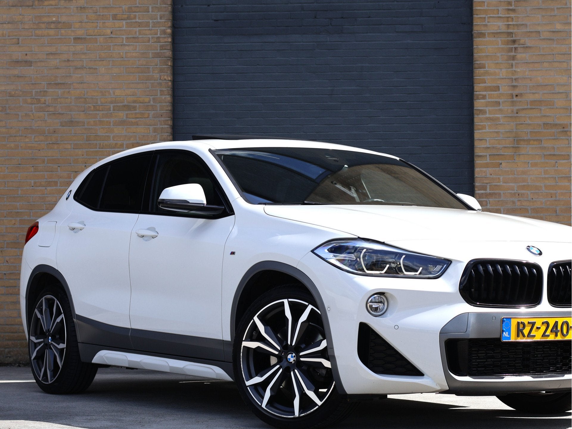 BMW X2 sDrive20i M Sport X Pano | HUD | 20" M | Trekhaak | N, Auto's, X2, 1435 kg, Wit, Bedrijf