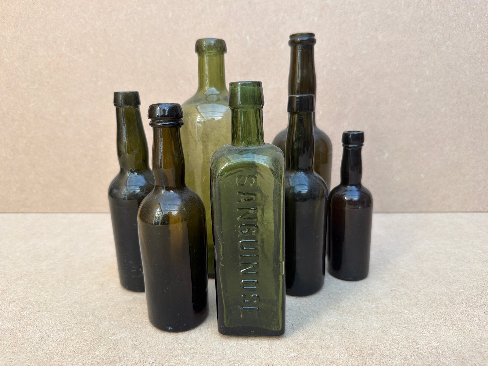 Set van 7 antieke flessen - Groen en bruin glas, Ophalen of Verzenden