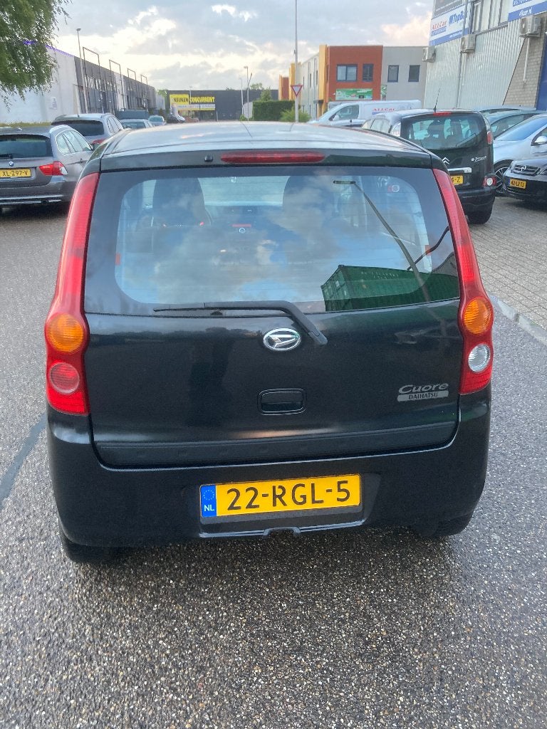 Daihatsu Cuore 1.0 5D 2011 Zwart, Auto's, Voorwielaandrijving, 600 kg, 18 €/maand, 4 stoelen