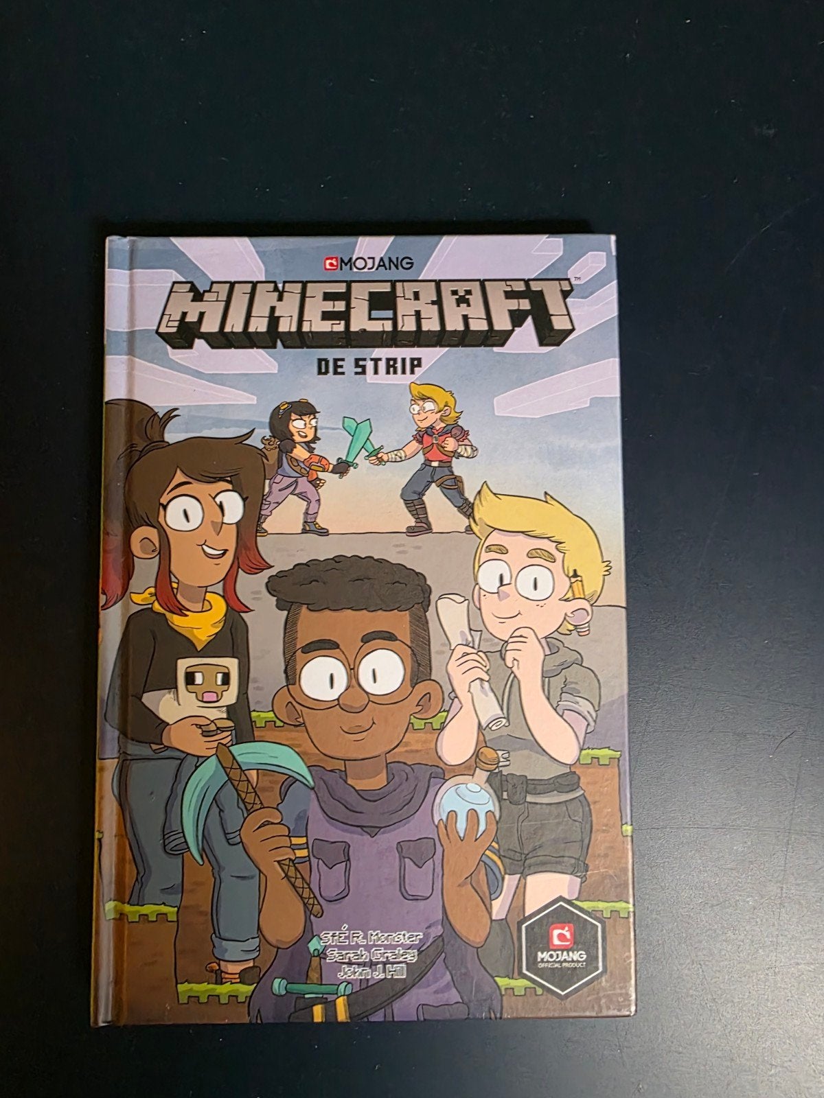 Minecraft: De Strip - Zo goed als nieuw, Boeken, Eén stripboek, Ophalen of Verzenden, Zo goed als nieuw, S.F.R. Koster, Sarah Graley, John H. Hill