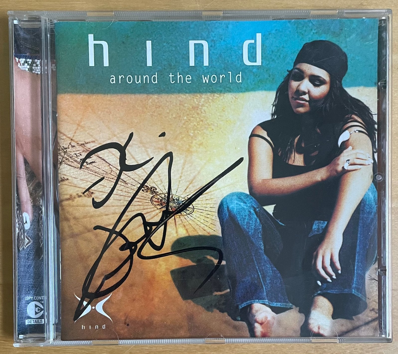 CD Hind; Around the world (gesigneerd), Ophalen of Verzenden, Gebruikt