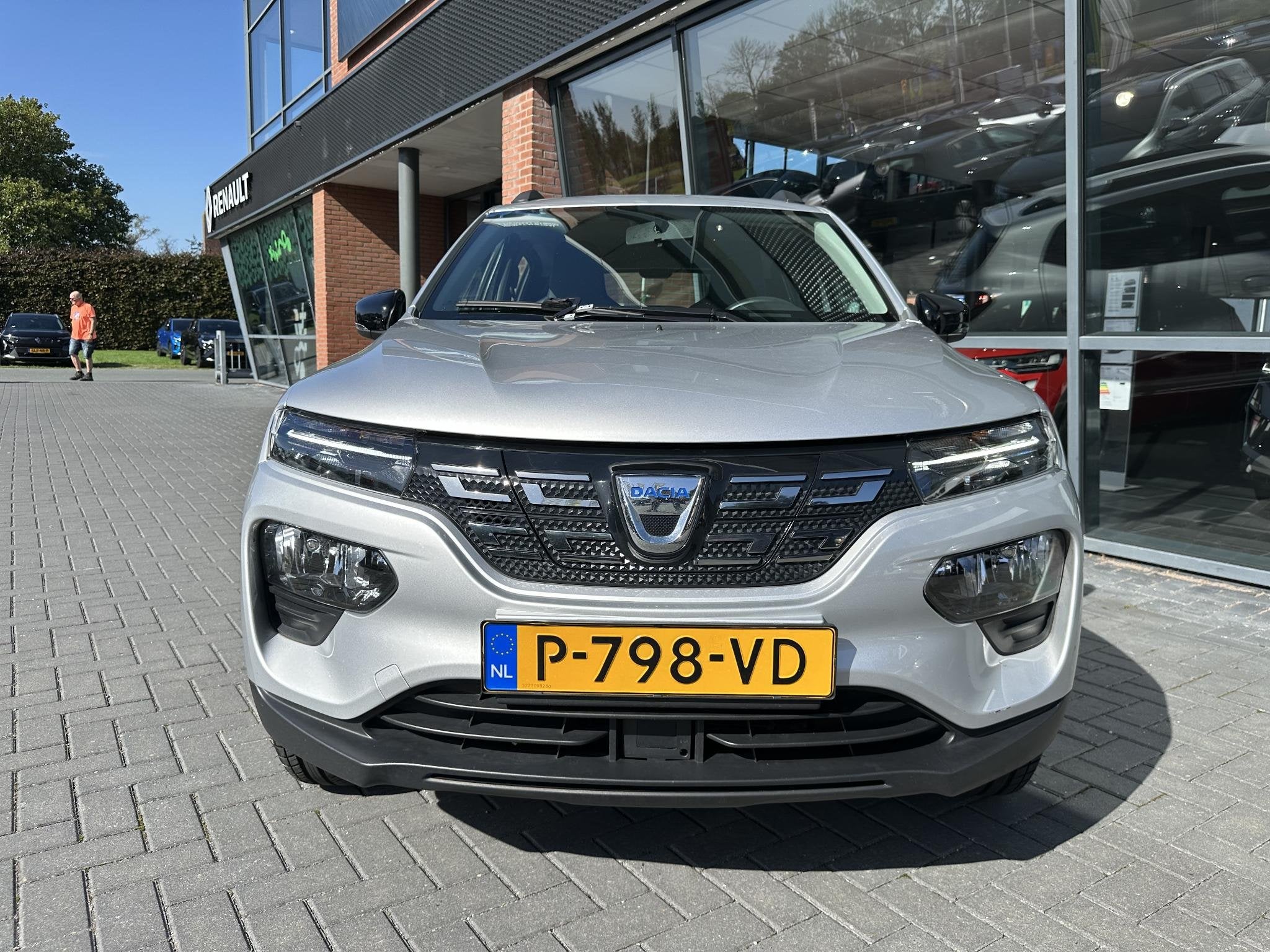 Dacia Spring Comfort Plus (Orange Pack) 27 kWh | CAMERA | PA, Auto's, Gebruikt, Zwart, 38 min, Leder en Stof