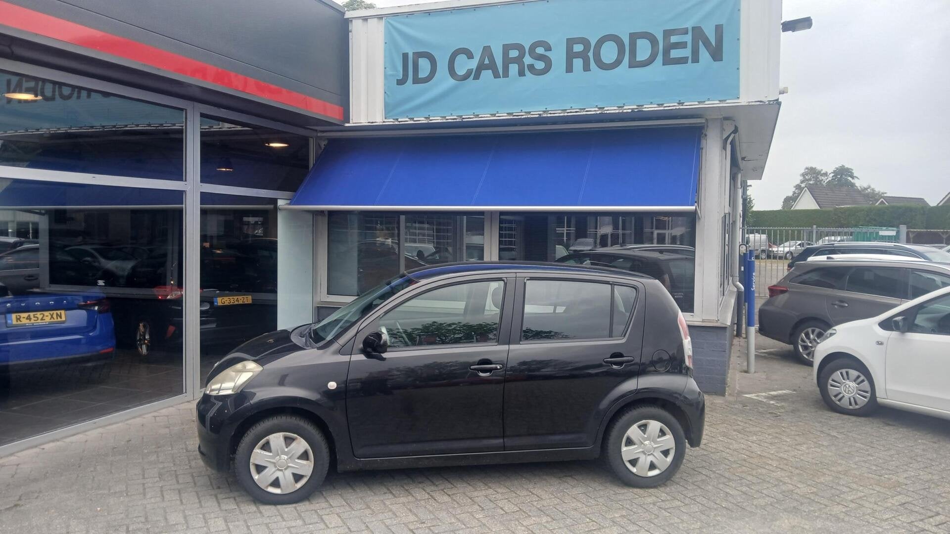 Daihatsu Sirion 2 1.0-12V Premium! Luxe! Lage km! let op!, Voorwielaandrijving, Gebruikt, Elektrische ramen, Zwart