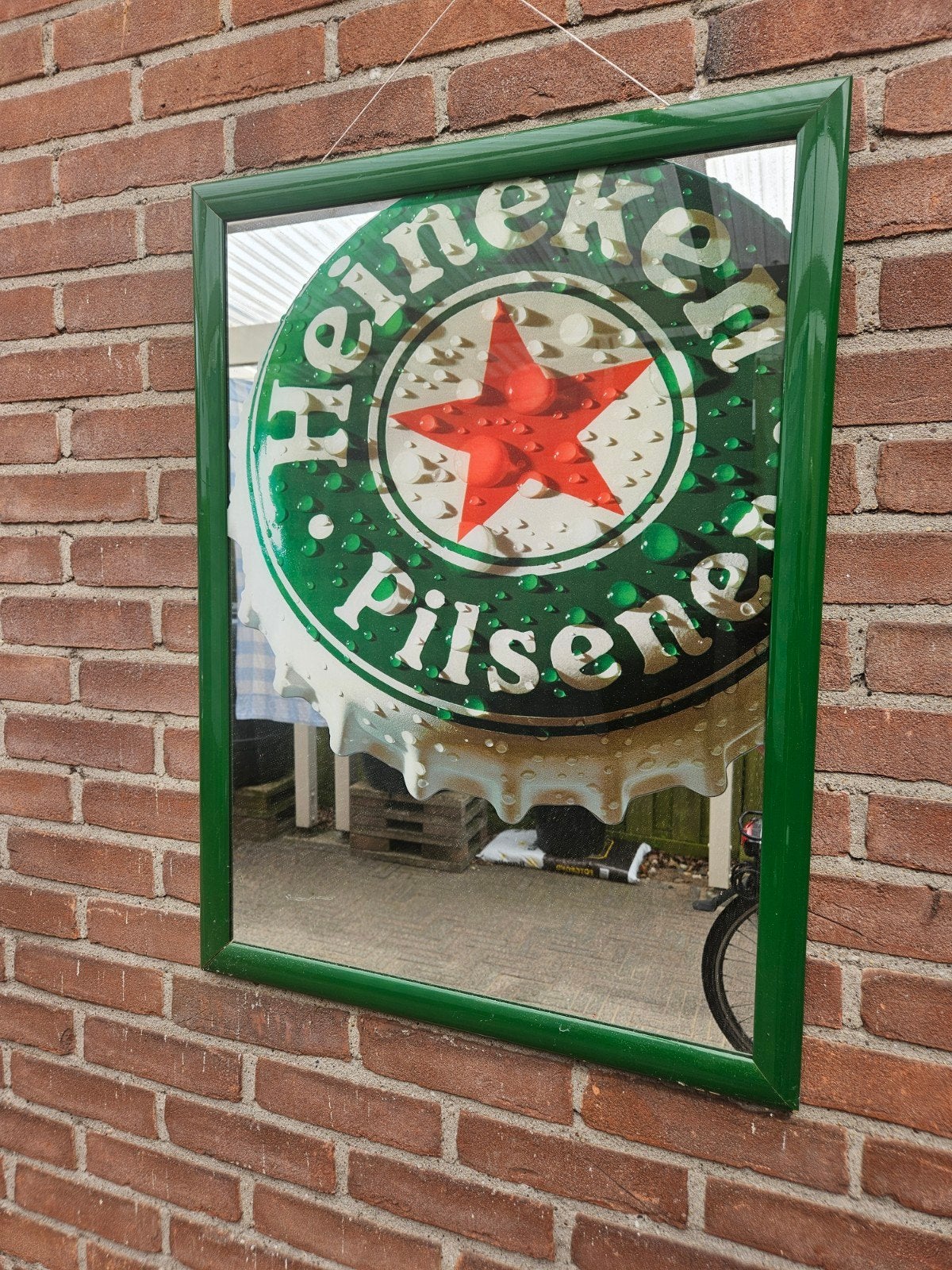 Mooie Heineken spiegel in een kapotte lijst., Verzamelen, Ophalen, Zo goed als nieuw, Reclamebord, Plaat of Schild, Heineken