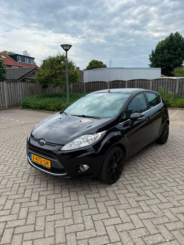 Ford Fiësta 1.25 82PK Titanium 5DR 2011 Zwart, Voorwielaandrijving, Euro 5, Stof, 1242 cc
