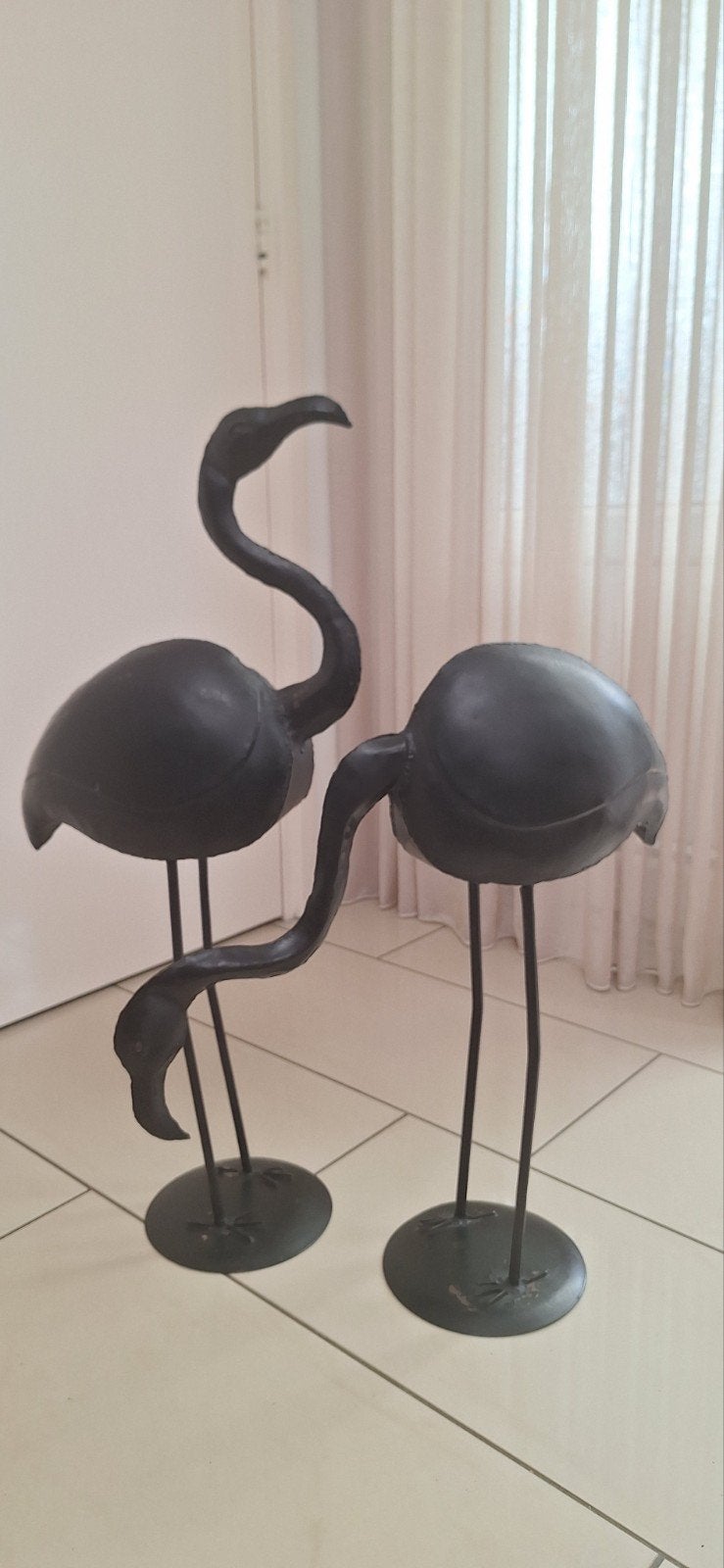Metalen flamingo's, Ophalen