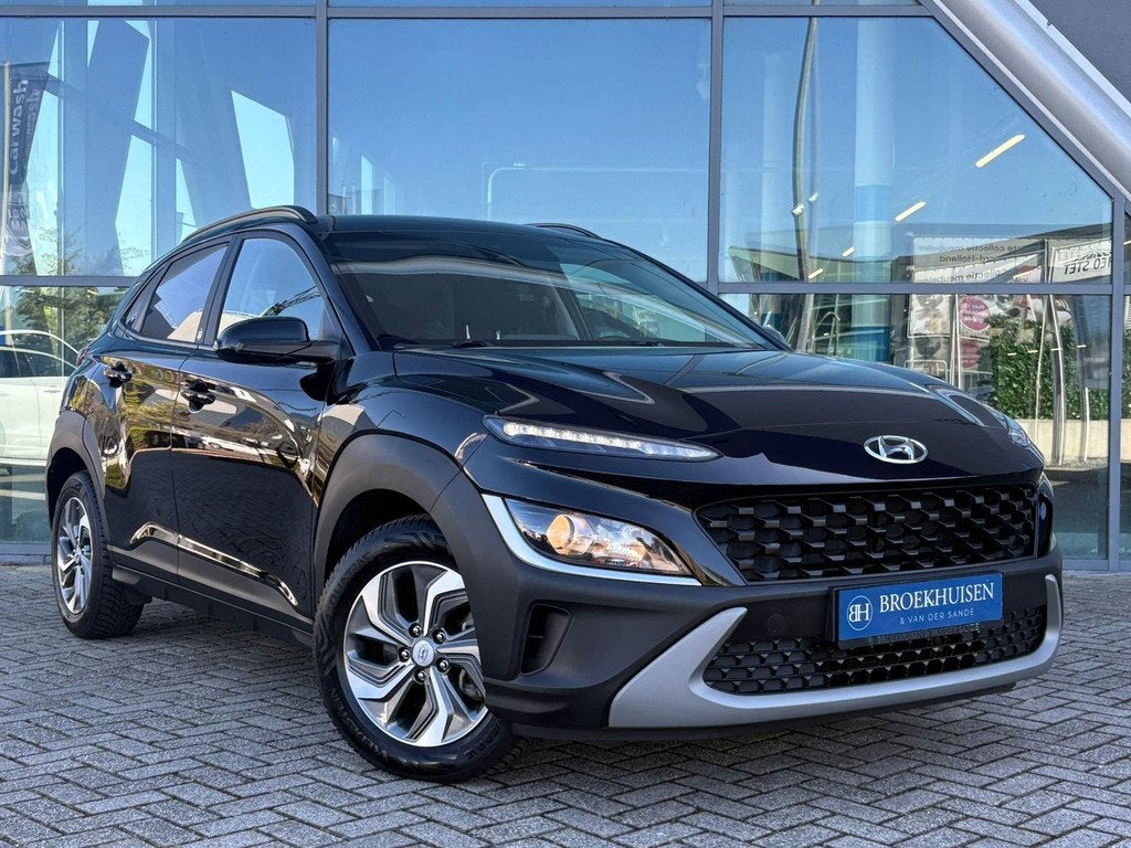 Hyundai Kona 1.6 GDI HEV Comfort Smart 141pk Camera / Trekha, Auto's, Stof, Gebruikt, Zwart, Bedrijf