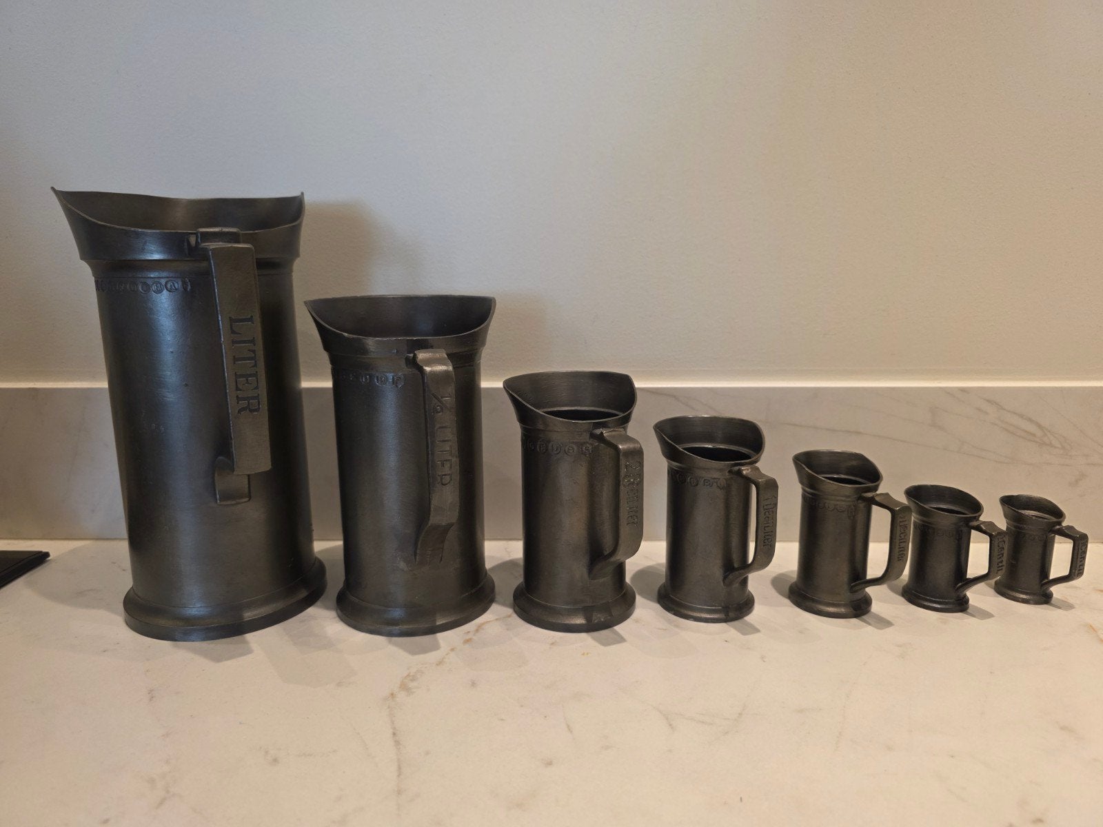 7 tinnen maatbekers, Ophalen of Verzenden