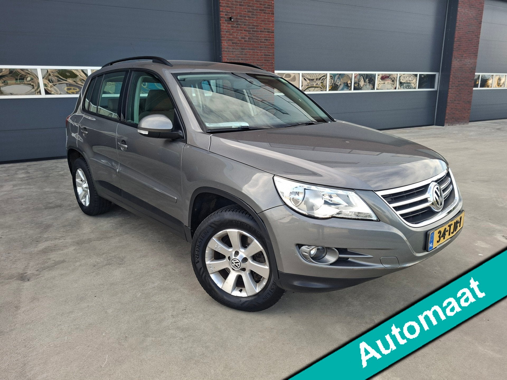 Volkswagen Tiguan 2.0 TSI Sport&Style 4Motion Automaat, Auto's, Automaat, Stof, Gebruikt, 4 cilinders