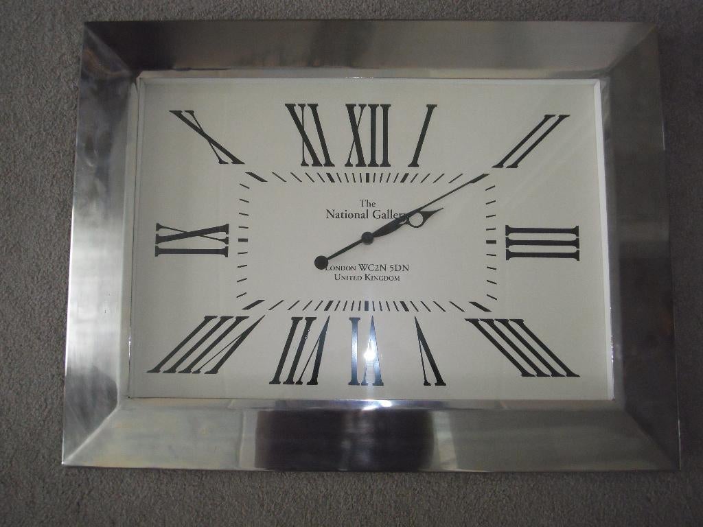 Wandklok omlijsting Chrome., Huis en Inrichting, Woonaccessoires | Schilderijen, Tekeningen en Foto's, Ophalen of Verzenden, Zo goed als nieuw
