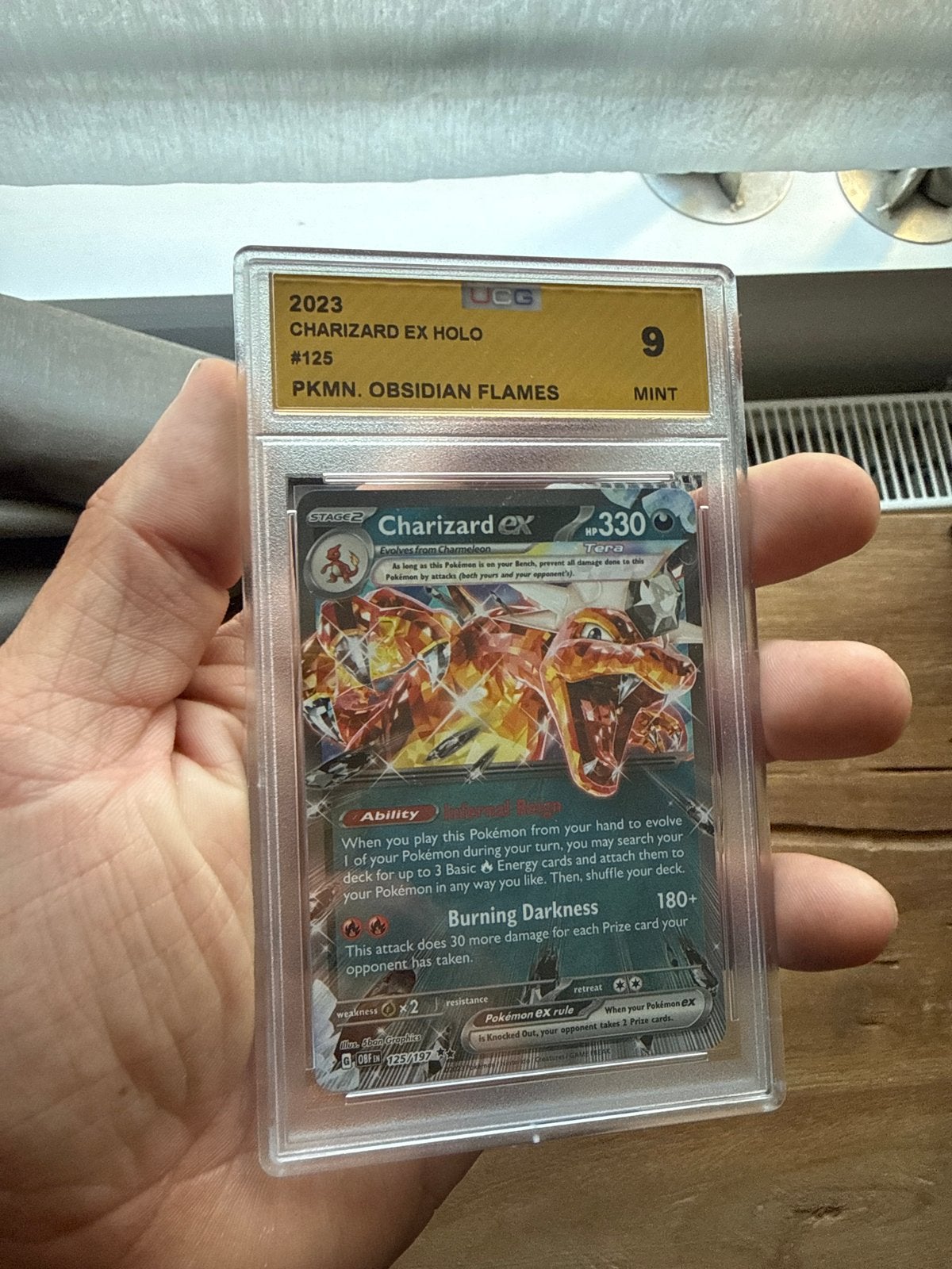 Charizard ex Holo #125 PKMN Obsidian Flames UCG 9 Mint, Ophalen of Verzenden, Zo goed als nieuw, Losse kaart, Foil