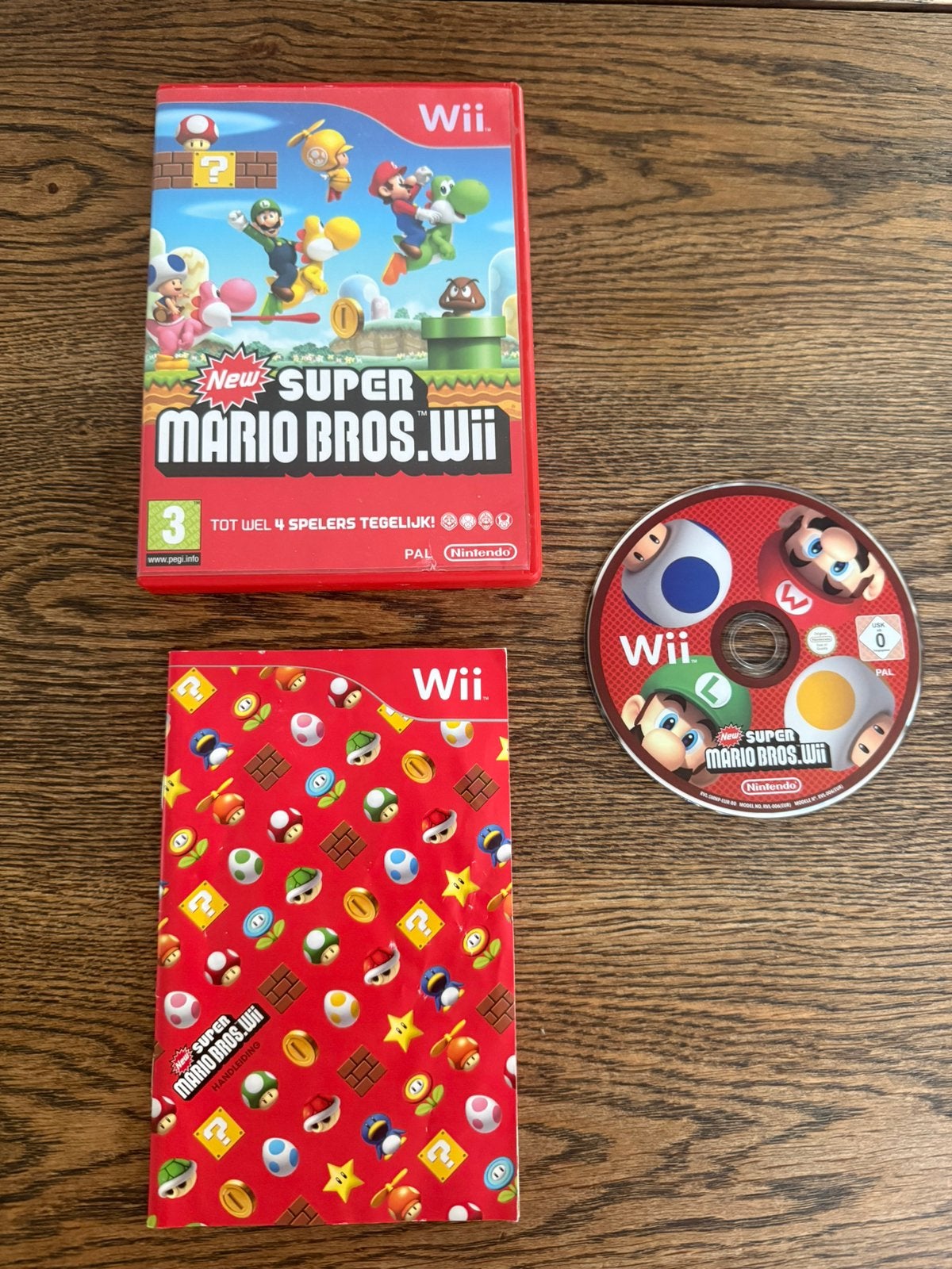 New Super Mario Bros. Wii | Compleet met handleiding |, 3 spelers of meer, Ophalen of Verzenden, Zo goed als nieuw, Vanaf 3 jaar