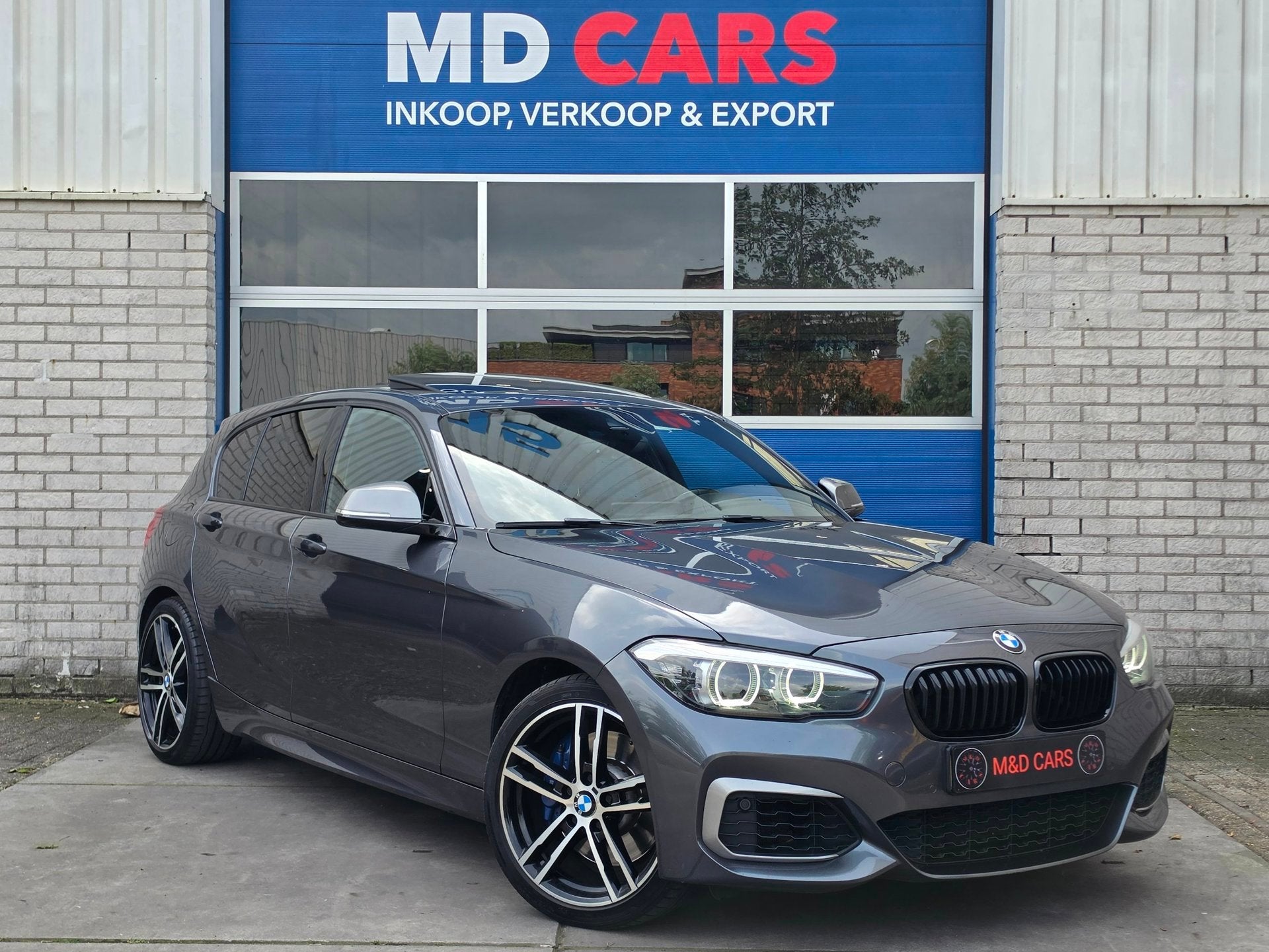 BMW 1-serie M140i xDrive High Executive SCHUIFDAK/MEMORY STO, Auto's, Gebruikt, Alcantara, 340 pk, 14 km/l