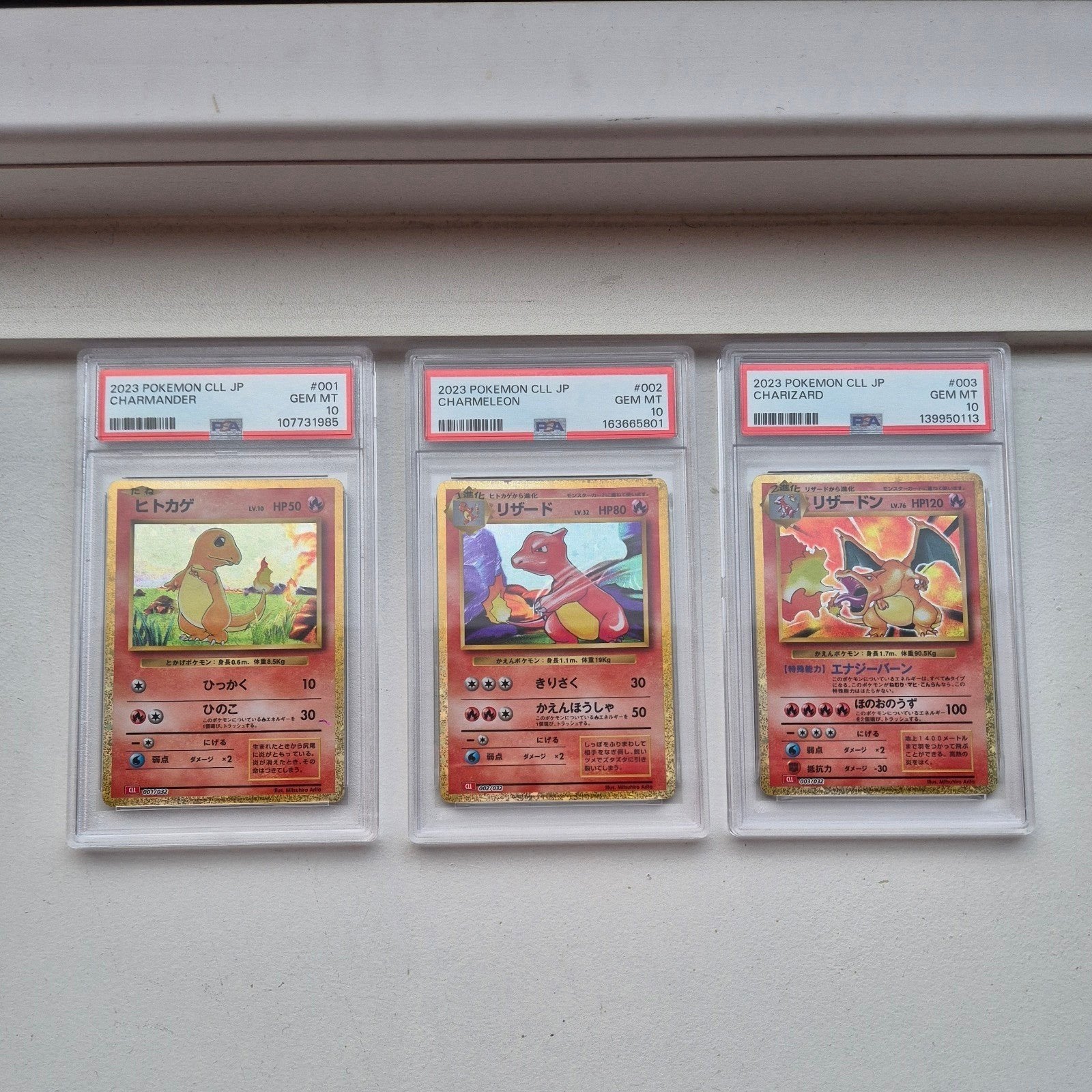Pokémon Charmander, Charmeleon, Charizard - PSA 10, Ophalen of Verzenden, Zo goed als nieuw, Meerdere kaarten, Foil