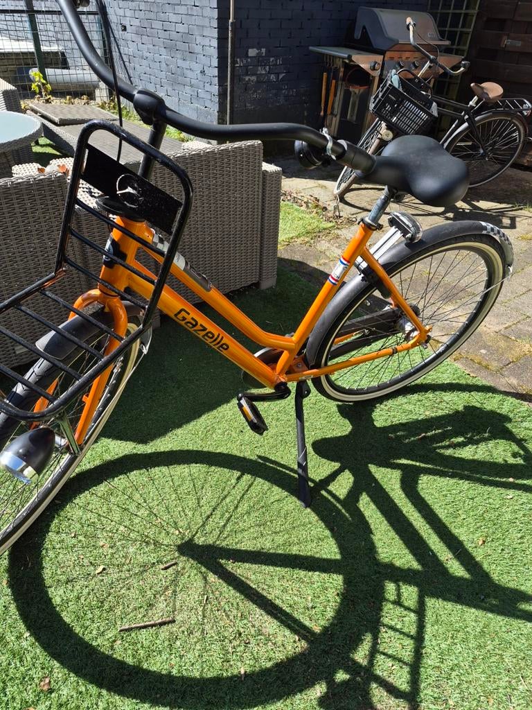 Gazelle Stadsfiets Oranje - Zo goed als nieuw, Fietsen en Brommers, Fietsen | Dames | Damesfietsen, Ophalen, Velgrem, Versnellingen
