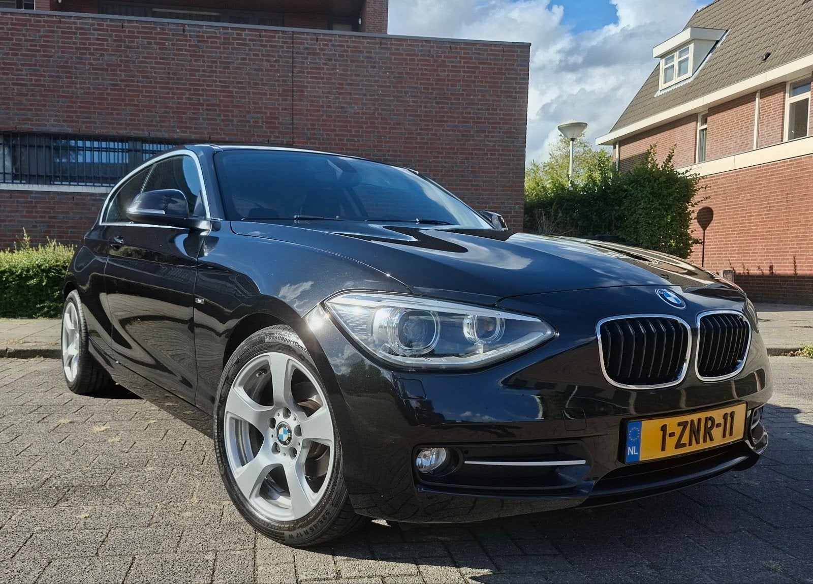 BMW 114i Sport | 2015 | 202.000 km | Groot onderhoud, 1-Serie, Achterwielaandrijving, 4 cilinders, Zwart