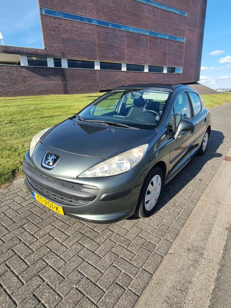 Peugeot 207 Grijs apk 05/2027, Auto's, 1360 cc, 49 €/maand, 1123 kg, Te koop
