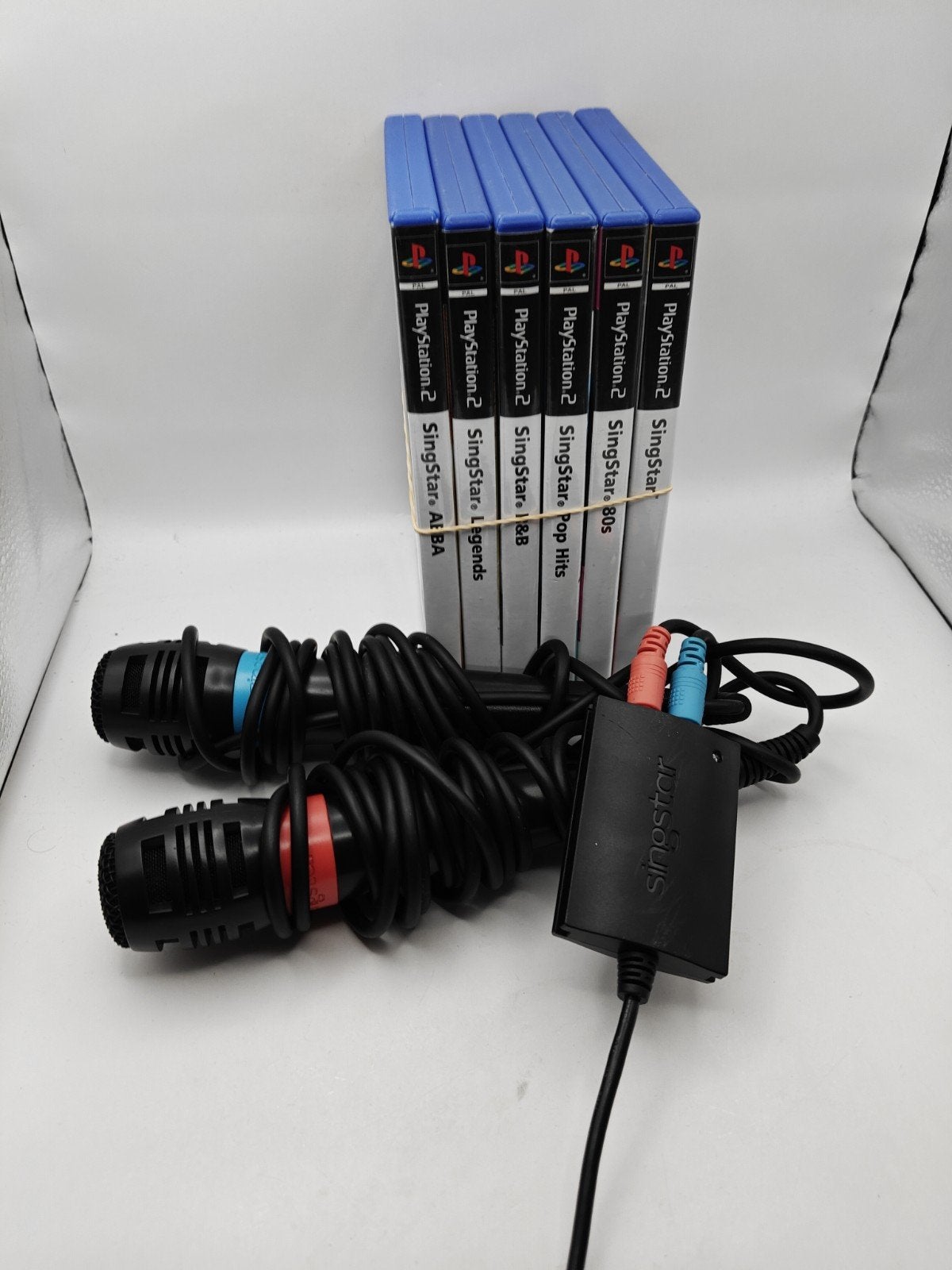 SingStar PlayStation 2 Bundel met 6 Spellen en Microfoons, Muziek, Gebruikt, Eén computer, Ophalen of Verzenden