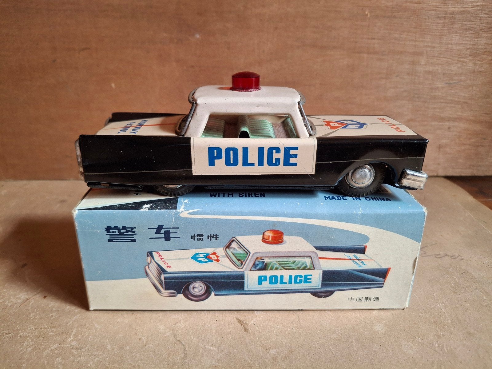 blikken politieauto MF 224 met doos &werkende sirene, Antiek en Kunst, Antiek | Speelgoed, Ophalen of Verzenden