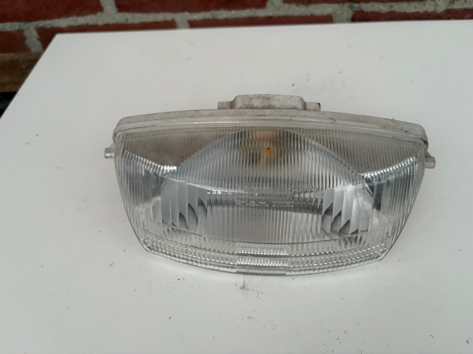 piaggio quartz koplamp, Ophalen