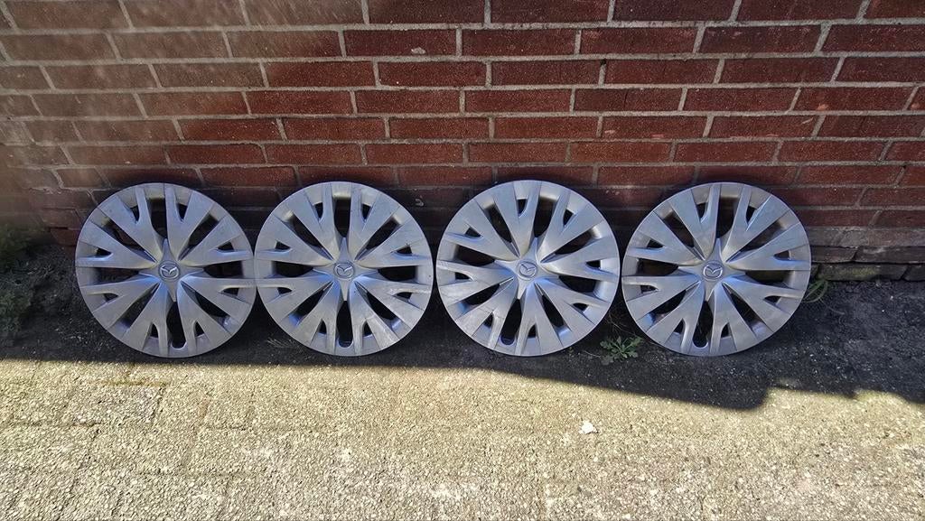 4x Mazda wieldoppen 15 inch, Ophalen of Verzenden, Gebruikt