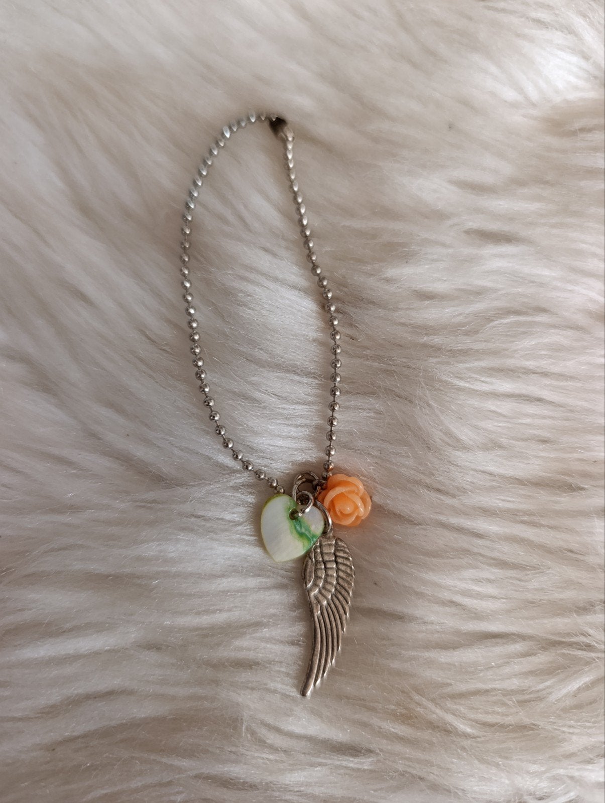 Zilverkleurige armband met hart, vleugel en roosje, Ophalen of Verzenden, Zo goed als nieuw, Zilver, Overige materialen