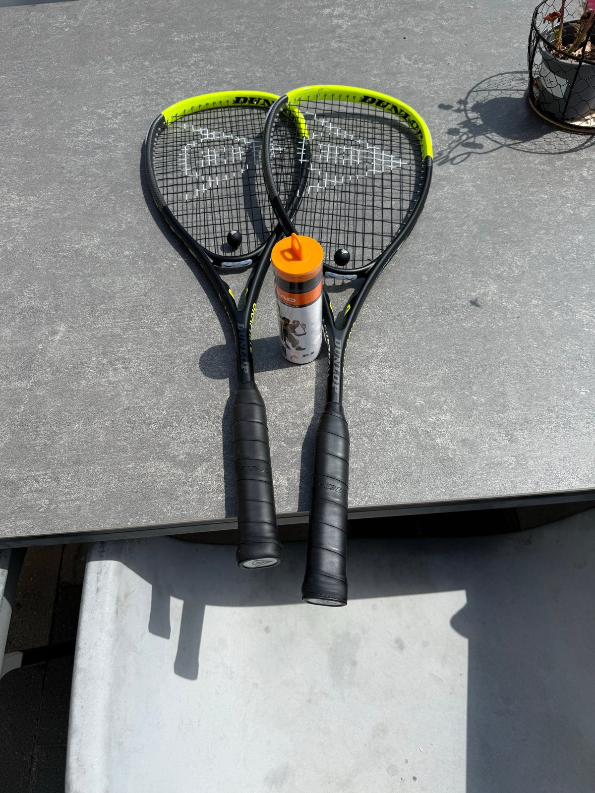 2 Dunlop Blackstorm Graphite Squash Rackets + HEAD ballen, Sport en Fitness, Squash, Ophalen, Zo goed als nieuw, Racket