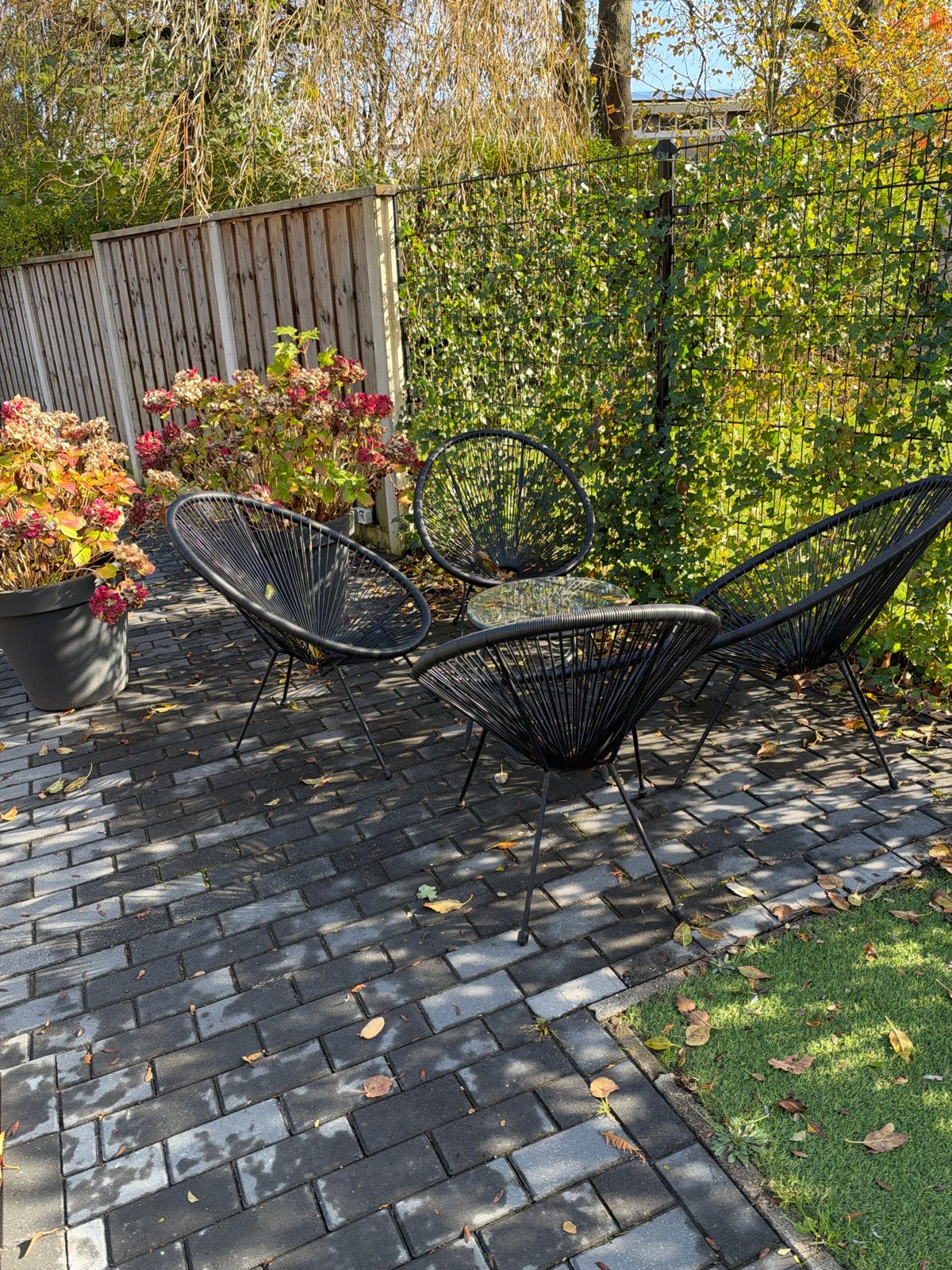 Zwarte tuinset met 4 stoelen en glazen tafel, Tuin en Terras, 4 zitplaatsen, Kunststof, Gebruikt, Ophalen of Verzenden