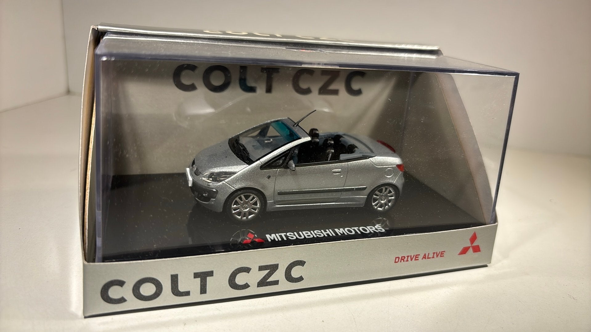 Mitsubishi colt czc silver sun star 1.43, Hobby en Vrije tijd, Modelauto's | 1:43, Overige merken, Auto, Ophalen of Verzenden