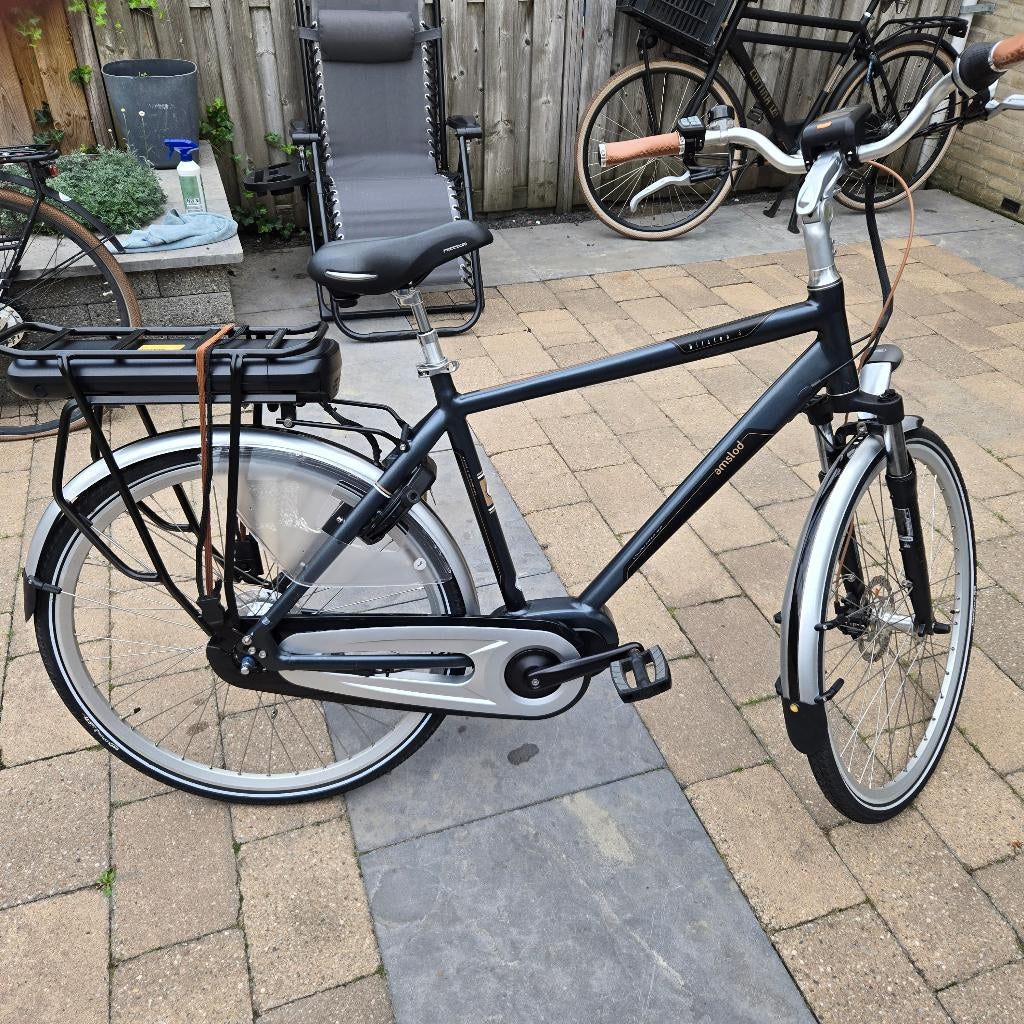 Amslod elektrische herenfiets., Zo goed als nieuw, 50 km per accu of meer, 55 tot 59 cm, Ophalen