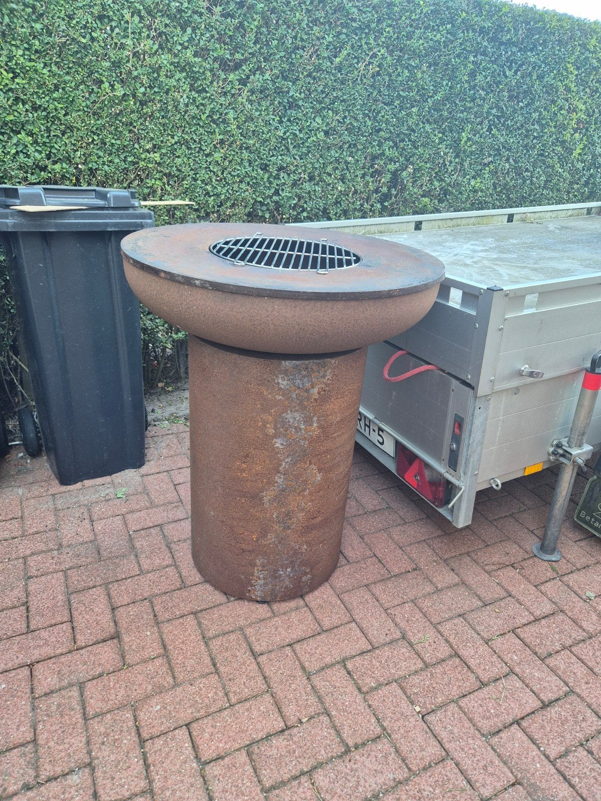 Ronde BBQ en Vuurkorf in één, Ophalen