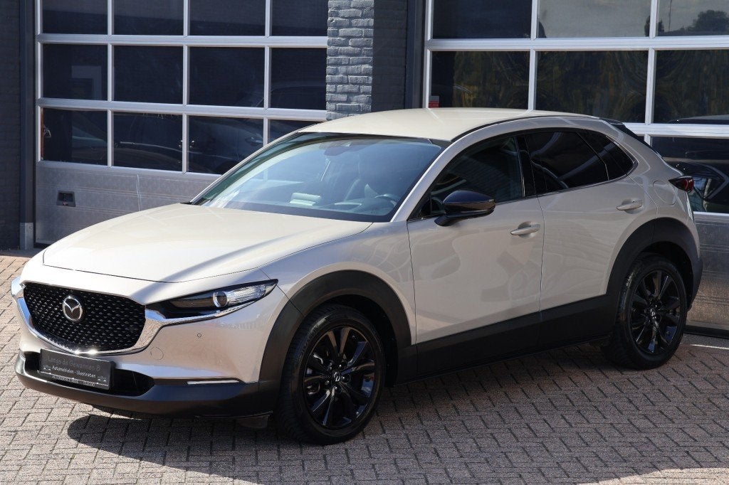 Mazda CX-30 2.0 e- skyactiv X-M Hybrid Homura automaat 186 p, Auto's, 1998 cc, Gebruikt, Met garantie (alle), Beige