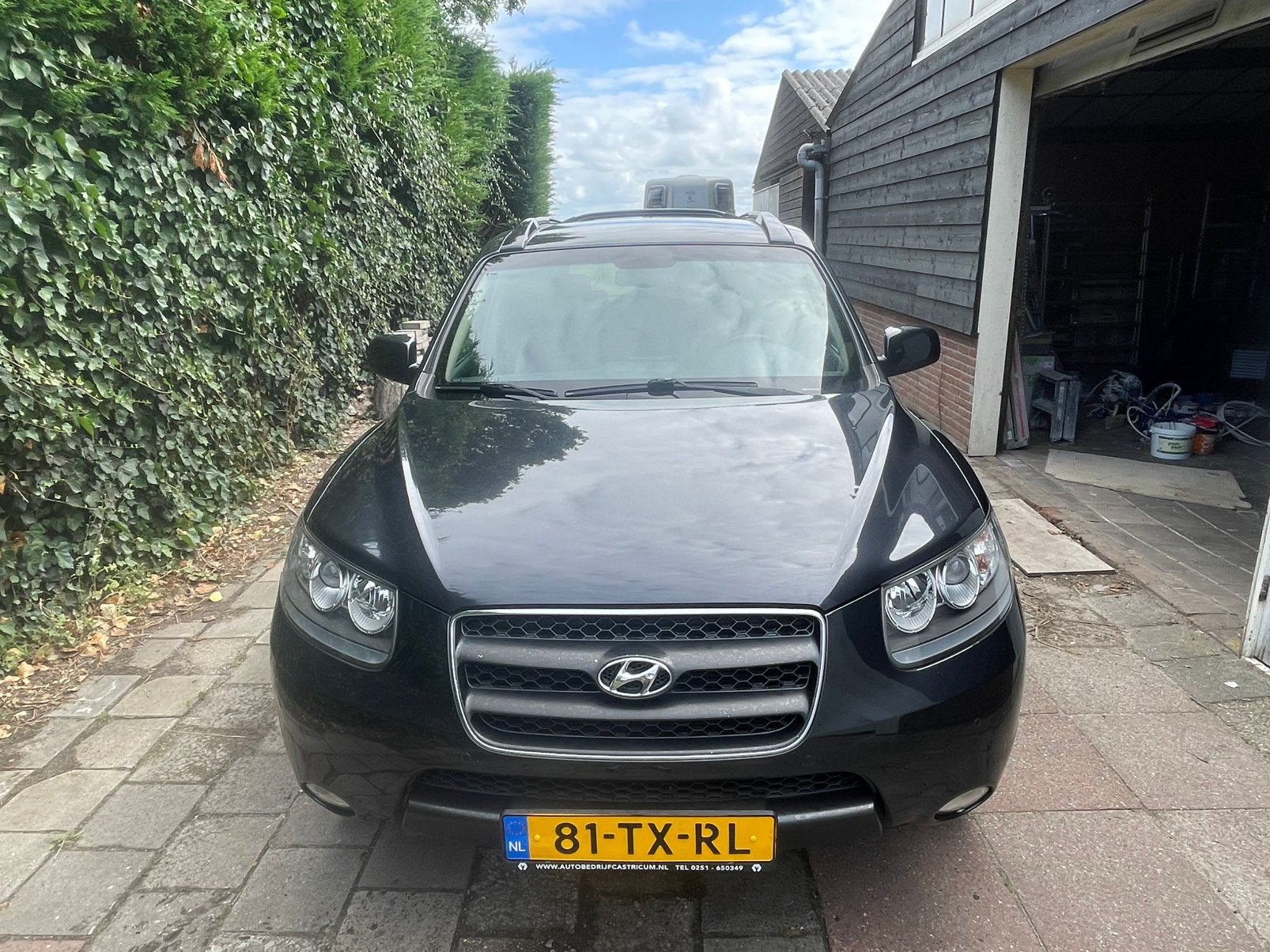 Hyundai Santa Fe 2.7 2WD 7-ST AUT 2007 Zwart, Auto's, Hyundai, Santa Fe, Beige, 2000 kg, Zwart