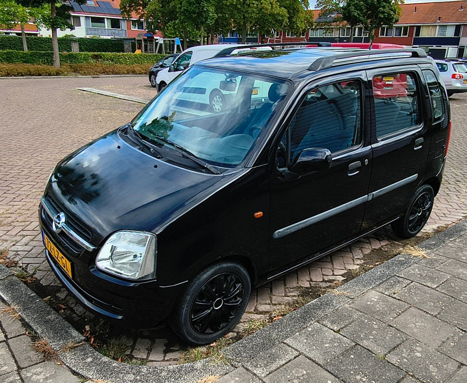 Opel Agila 1.2 16V 2003 Zwart, Auto's, Voorwielaandrijving, Stof, Zwart, Origineel Nederlands