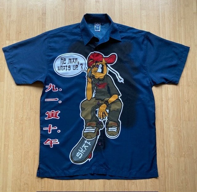 Donkerblauwe blouse met korte mouwen en print skateboarder., Kinderen en Baby's, Kinderkleding | Maat 158, Jongen of Meisje, Overhemd of Blouse