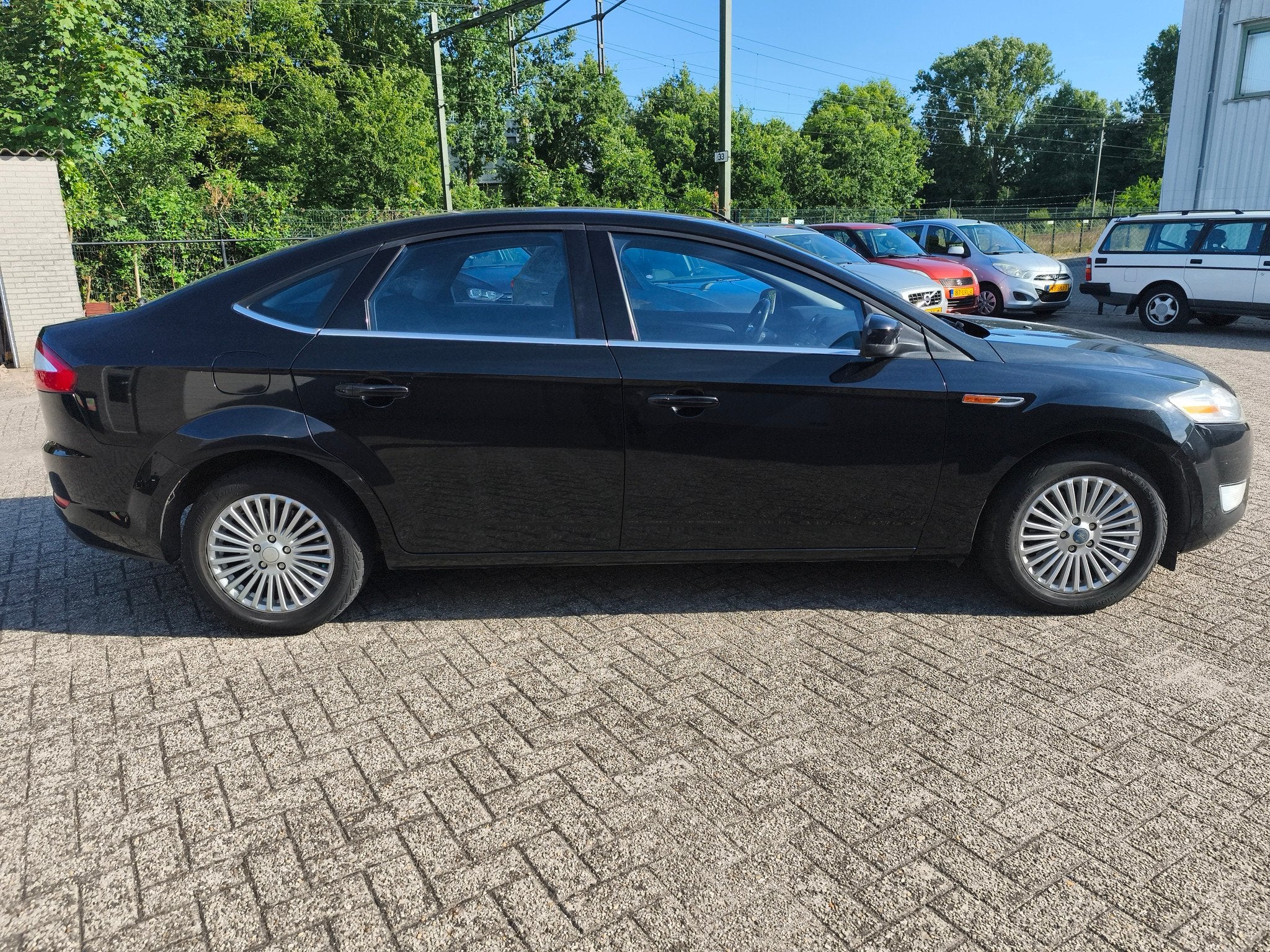 Ford Mondeo 2.0 16V Limited (bj 2010), Gebruikt, 4 cilinders, Zwart, Origineel Nederlands