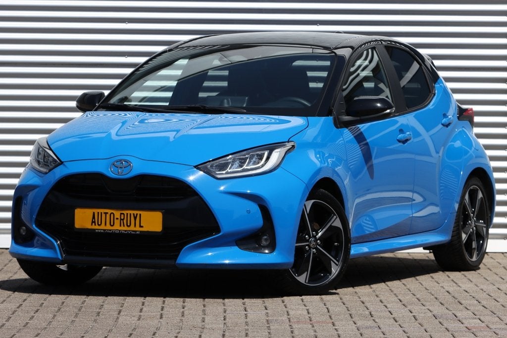 Toyota Yaris 1.5 Hybrid 130 Launch Edition Panoramadak, Auto's, Gebruikt, Blauw, Leder en Stof, 3 cilinders
