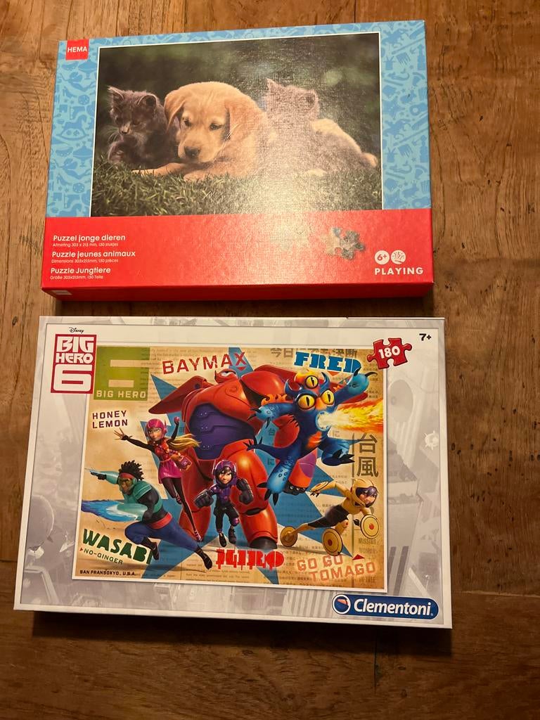 Twee puzzels: HEMA jonge dieren en Disney Big Hero 6, Ophalen of Verzenden, Meer dan 50 stukjes, Gebruikt, 6 jaar of ouder
