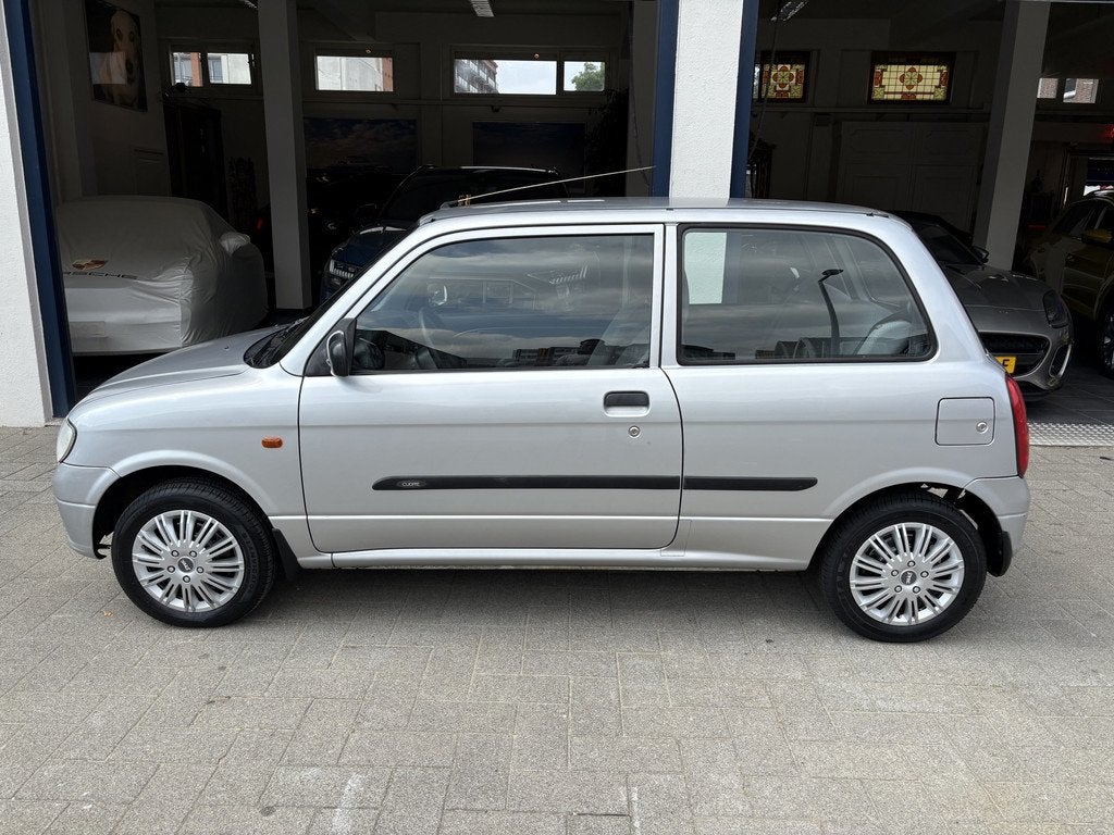 Daihatsu Cuore 1.0-12V XTi AUTOMAAT/NAP/NW APK 06-2027, Auto's, Oldtimers, 15 km/l, 4 stoelen, Origineel Nederlands, Zilver of Grijs