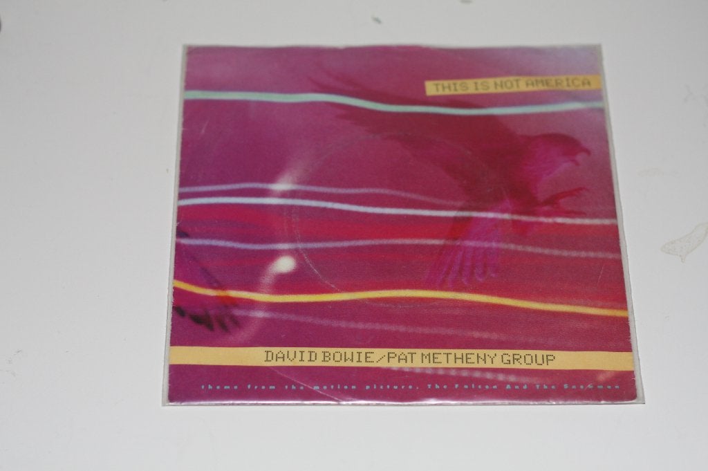 David Bowie - This is not America Mooie vinylsingle, Gebruikt, 7 inch, Overige typen, Verzenden