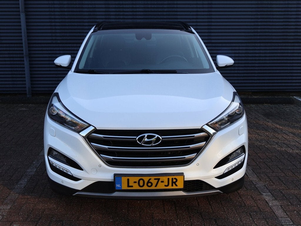 Hyundai Tucson 1.6 T-GDi Comfort 4WD Pano Camera Navi Keyles, Auto's, Hyundai, Gebruikt, 4 cilinders, Wit, Leder