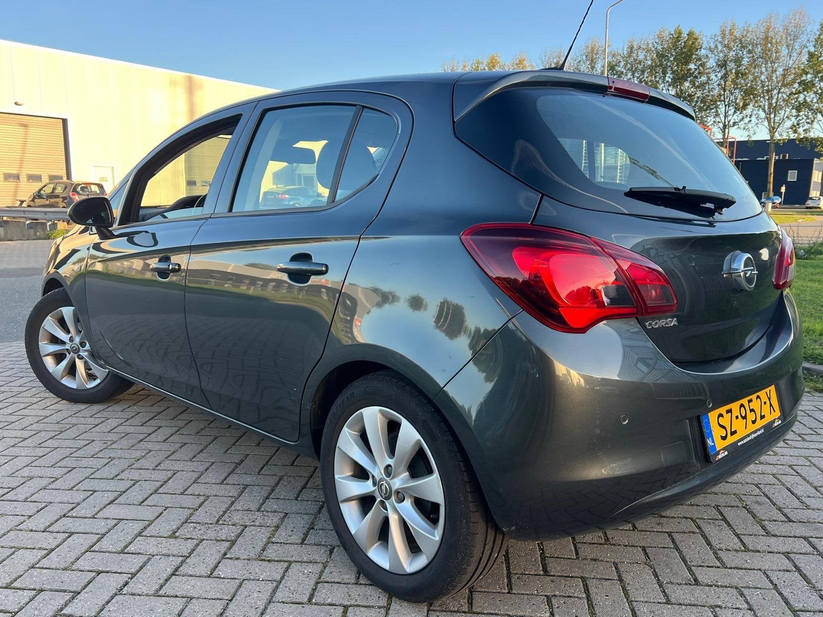 Opel Corsa 1.4 120 Jaar Edition LPG G3 5DRS Cruise Navi PDC, Voorwielaandrijving, Stof, Gebruikt, 4 cilinders