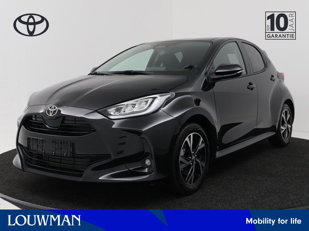 Toyota Yaris 1.5 Hybrid 115 Dynamic *NIEUW* (bj 2026), 12 maanden, Zwart, Nieuw, Hybride Elektrisch/Benzine