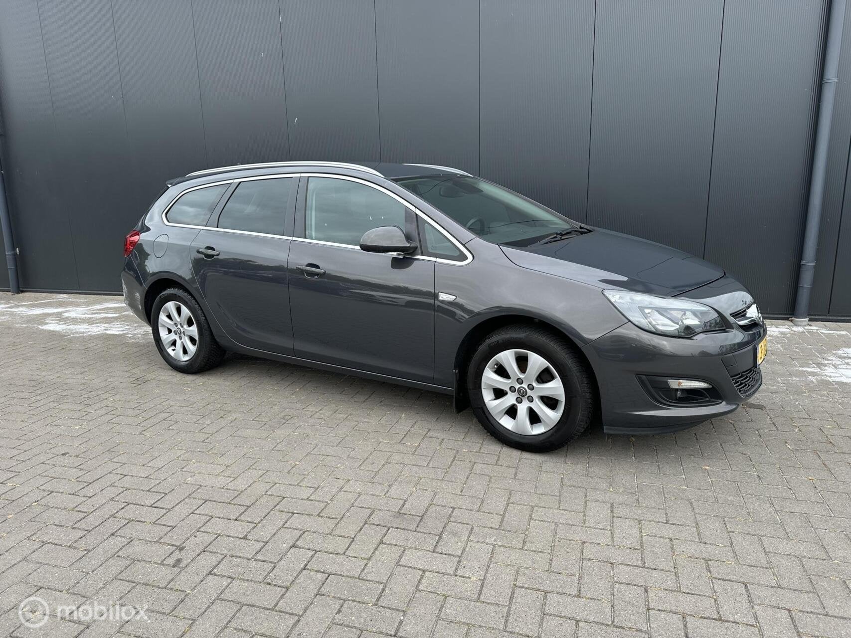 Opel Astra Sports Tourer 1.4 Turbo Business +, Auto's, Voorwielaandrijving, Euro 5, Gebruikt, Bluetooth