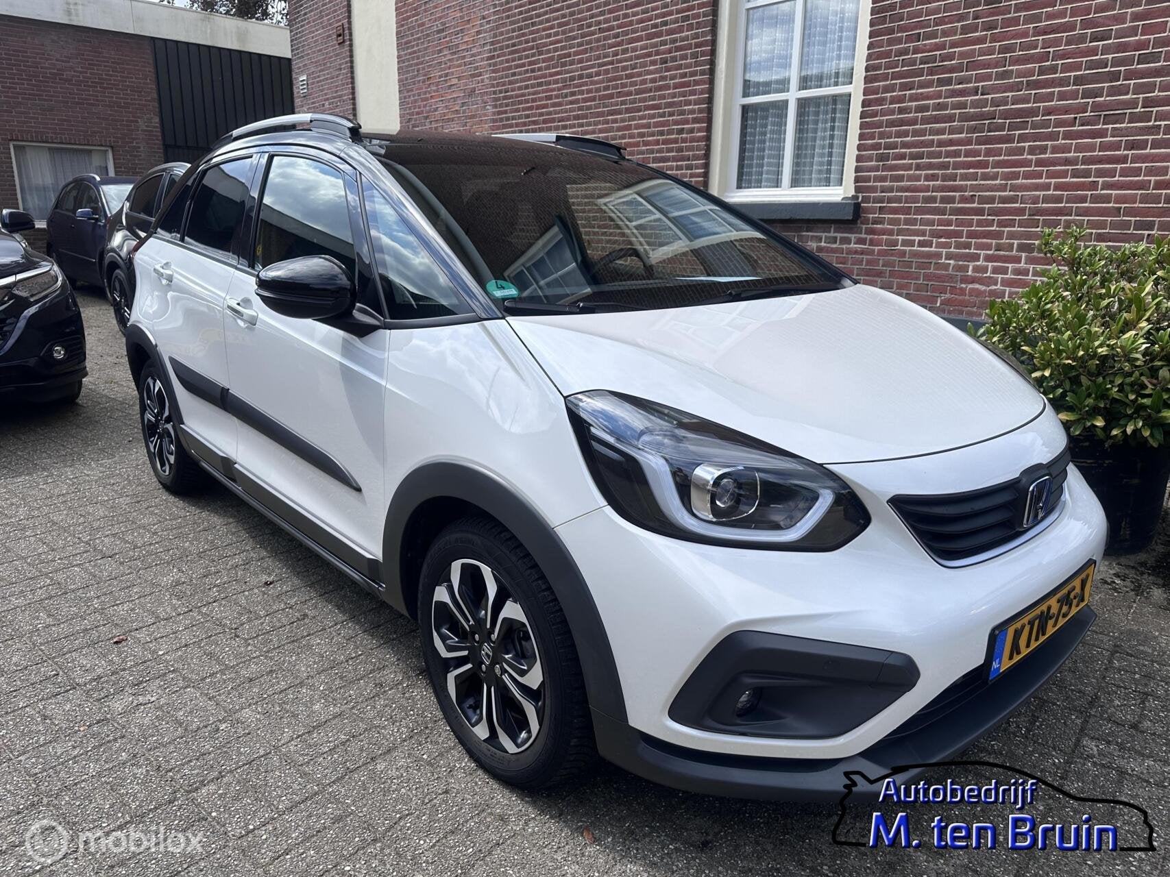Honda Jazz Hybrid 1.5 i-MMD e-CVT Crosstar 2tone all weather, Auto's, Honda, Dealer onderhouden, 4 cilinders, 1253 kg, Bedrijf