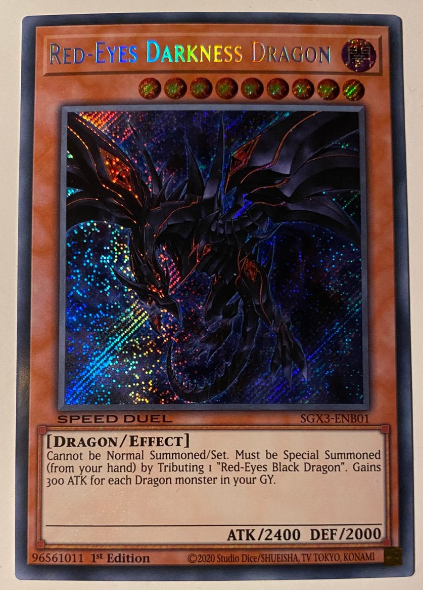 Yu-Gi-Oh! Red-Eyes Darkness Dragon SGX3 1st Edition !, Ophalen of Verzenden, Zo goed als nieuw, Losse kaart, Foil