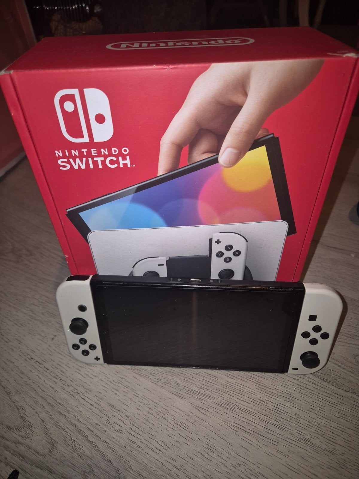 Nintendo Switch OLED met 2 controllers en 9 games