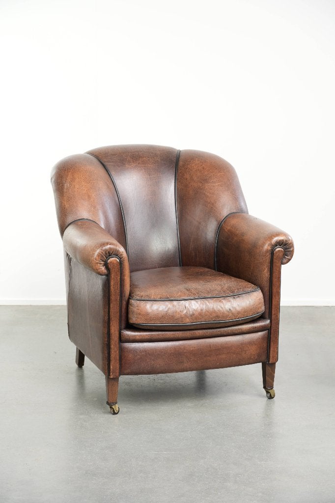 Karaktervolle en comfortabele vintage schapenleren fauteuil, Huis en Inrichting, Fauteuils, Ophalen, Gebruikt, Schapenleer, /