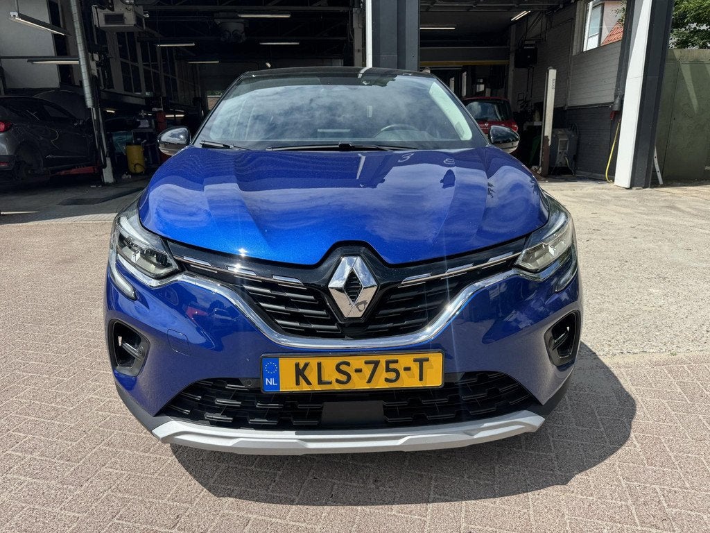 Renault Captur 1.6 E-Tech Hybrid 145 Intens, Gebruikt, 715 kg, Blauw, Leder en Stof
